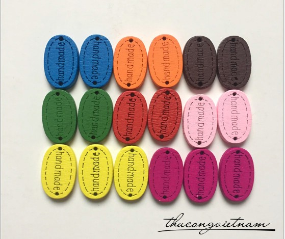 Nút gỗ màu bầu dục handmade