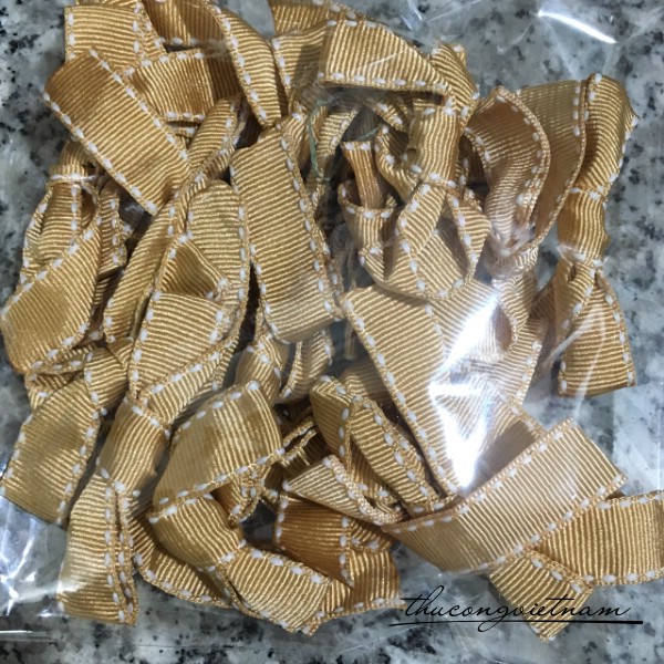 Nơ ruy băng gân màu vàng đồng